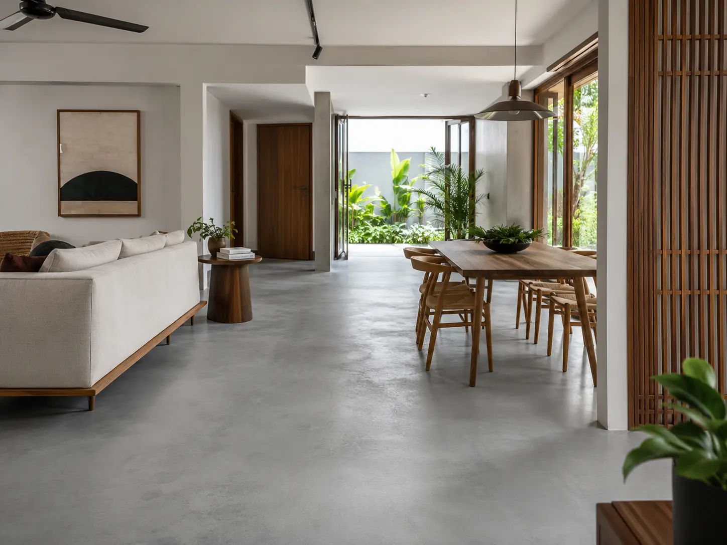 Living space with a seamless polished cement screed floor