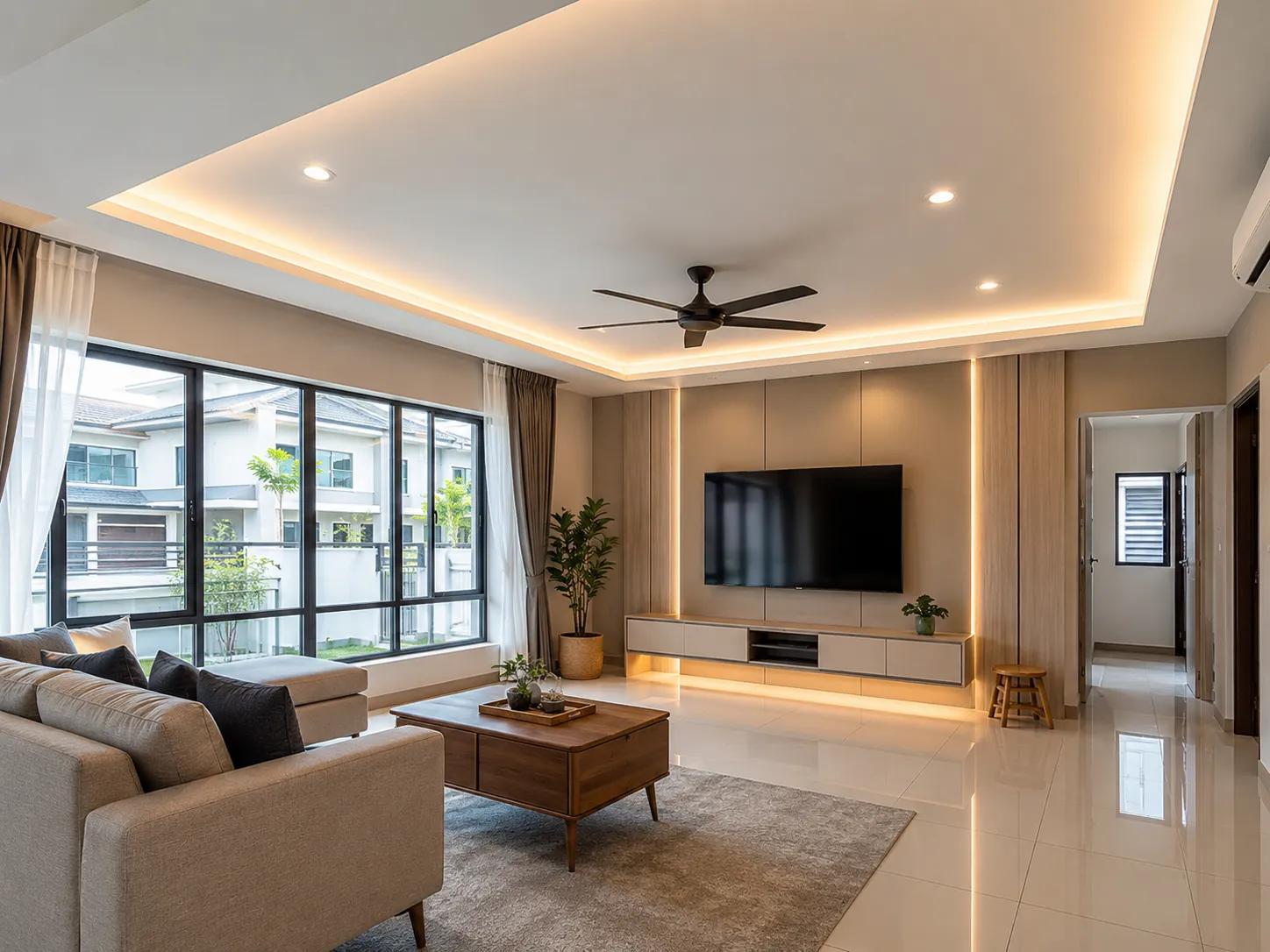 Living room with a cove-lit tray ceiling, recessed downlights and a wood-panelled TV feature wall